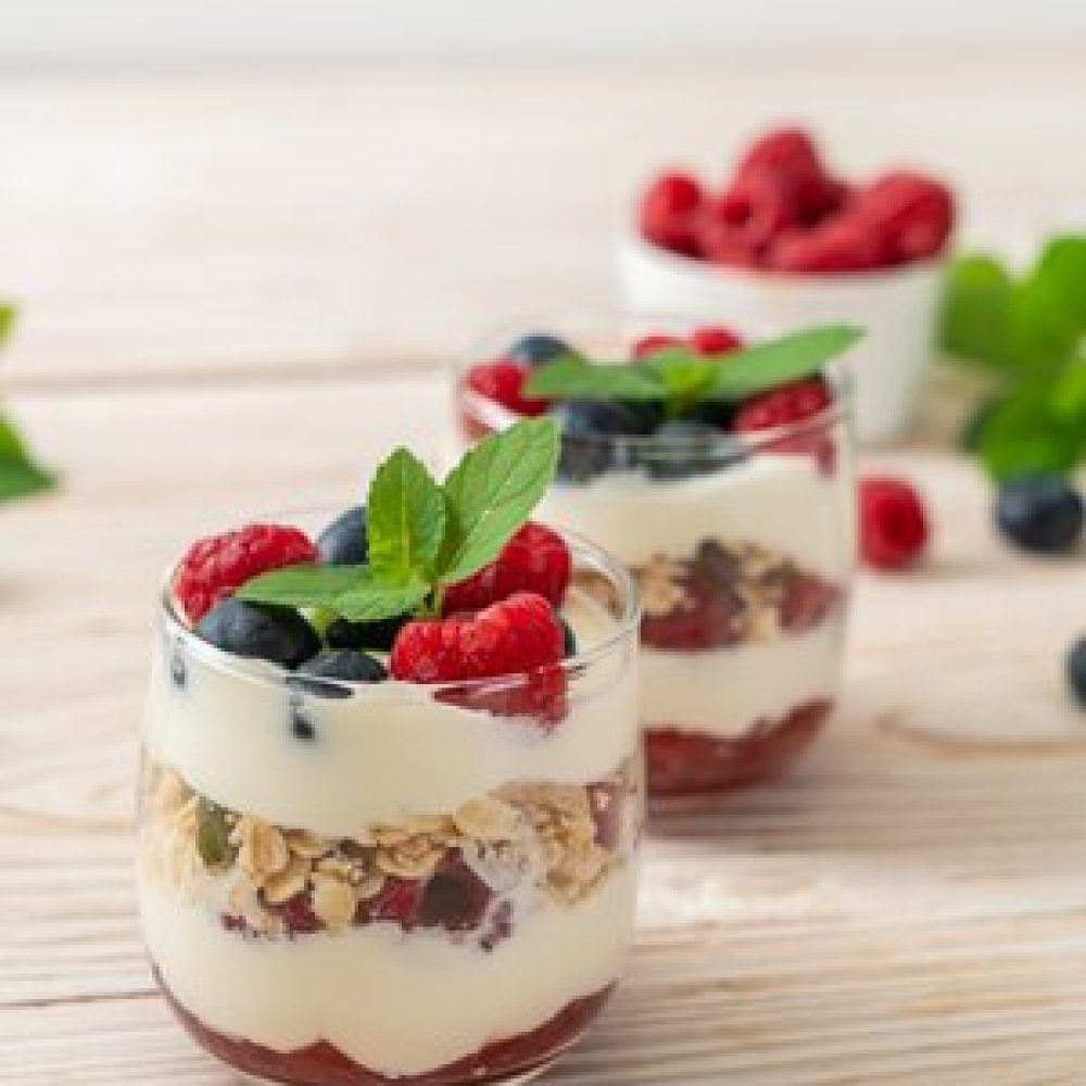homemade raspberry and blueberry with yogurt and granola - healthy food style
